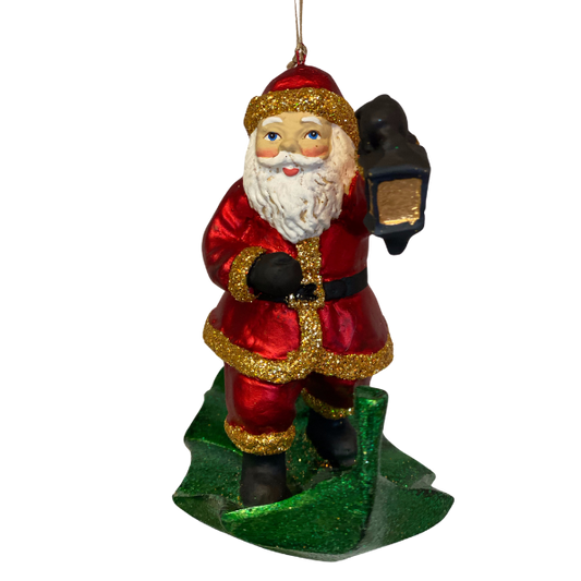 Julemanden rejser afsted på et blad