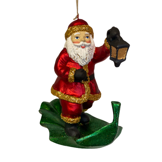 Julemanden rejser afsted på et blad